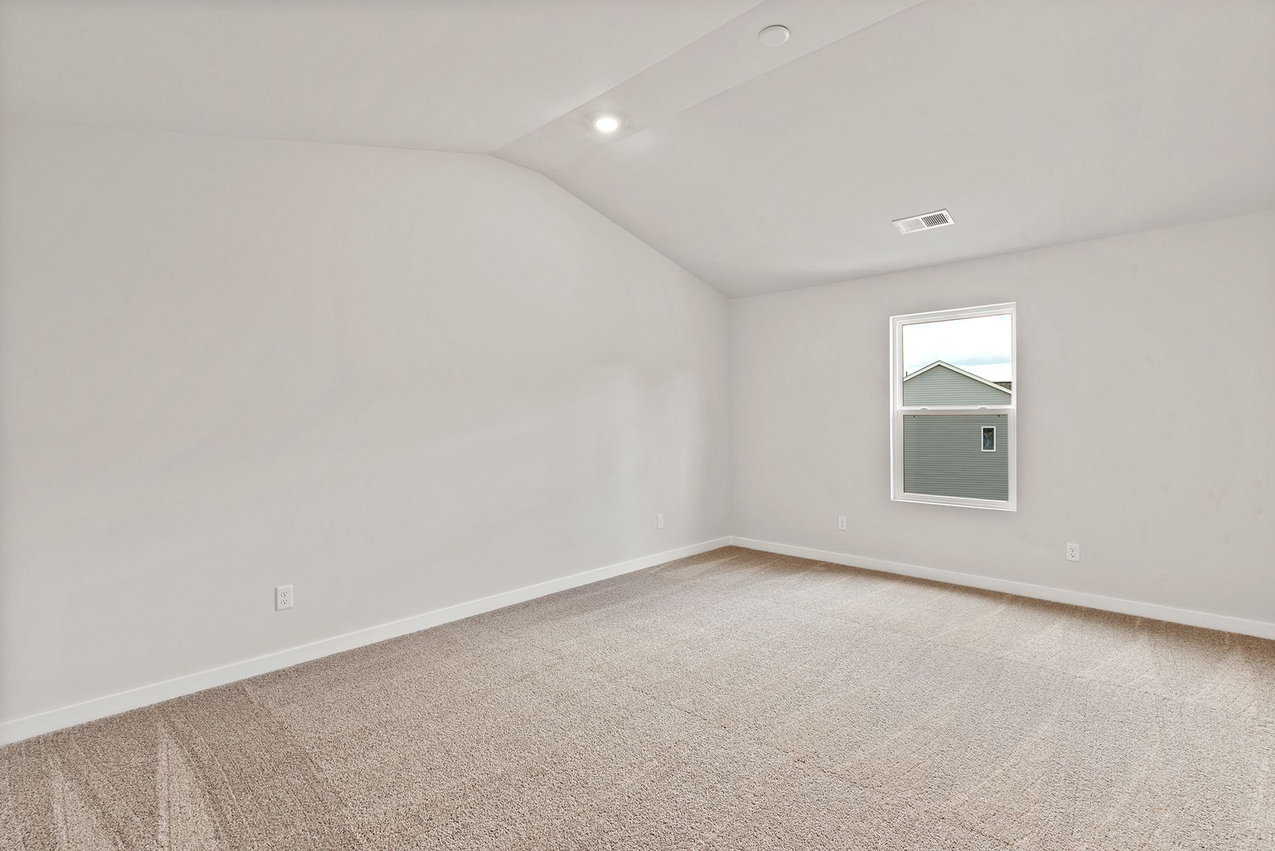 The master bedroom has lots of windows to let in natural light