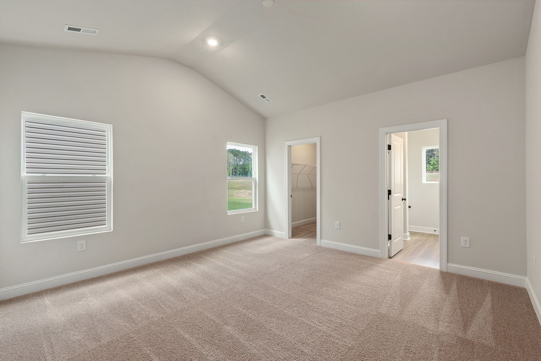 The master bedroom has enough space for your king-sized furniture.