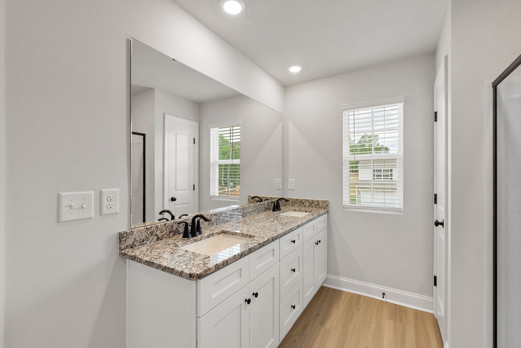 The master bathroom has double sinks