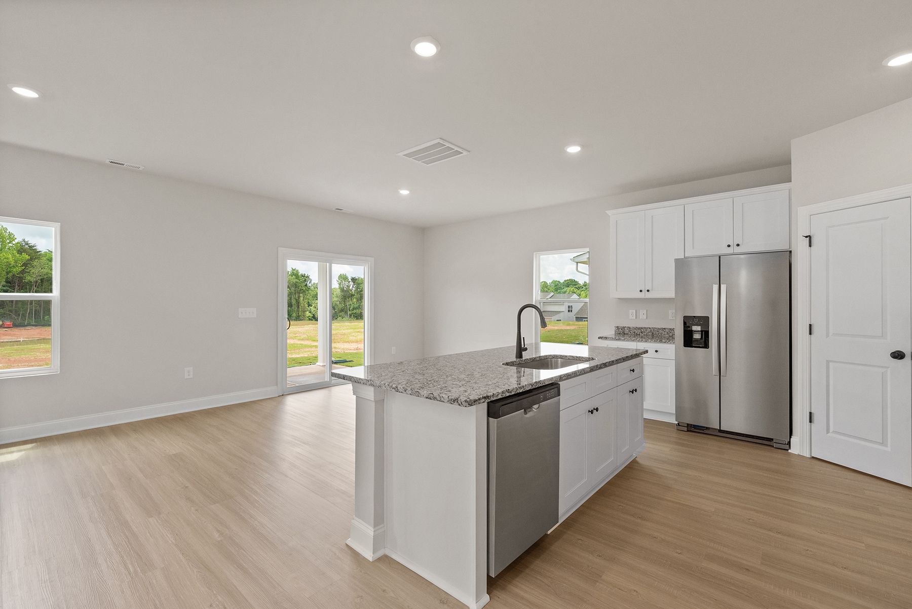 The island looks to the dining room