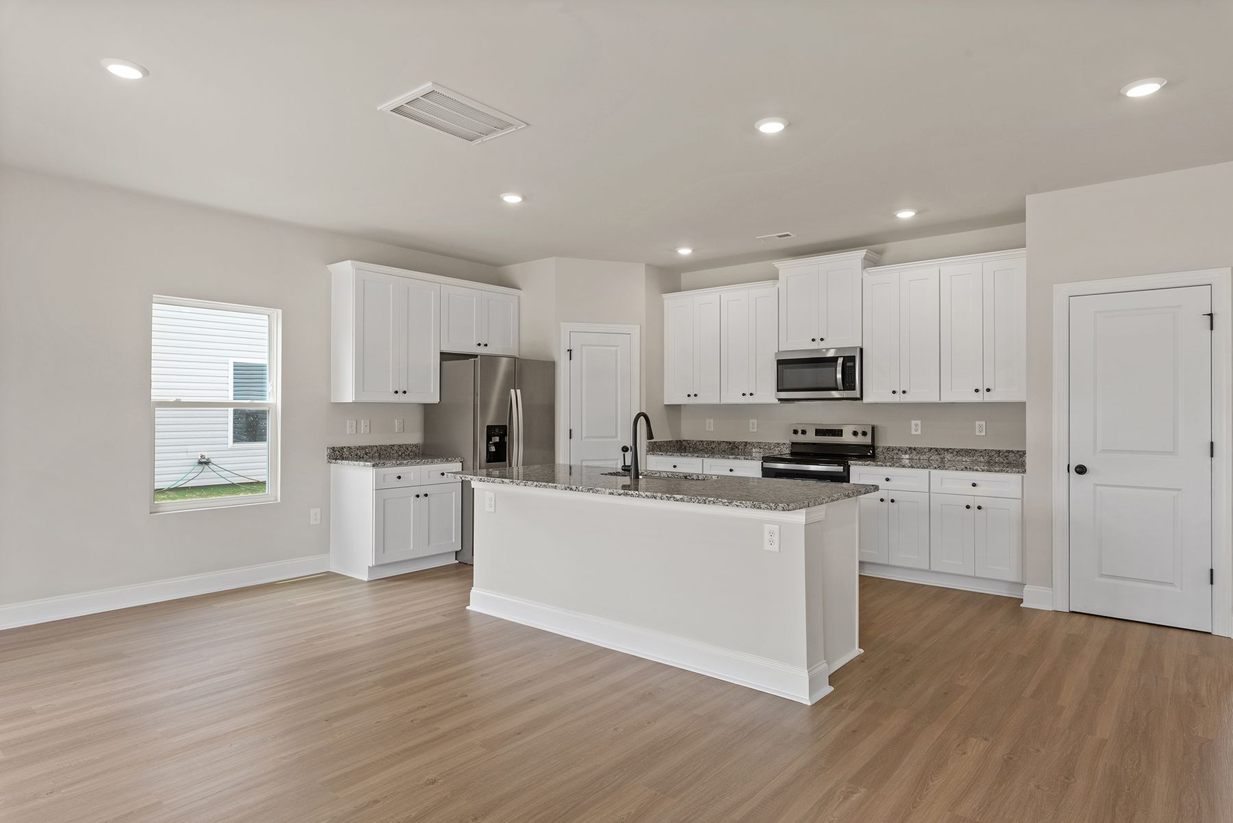 The kitchen island has lots of space for meal prep