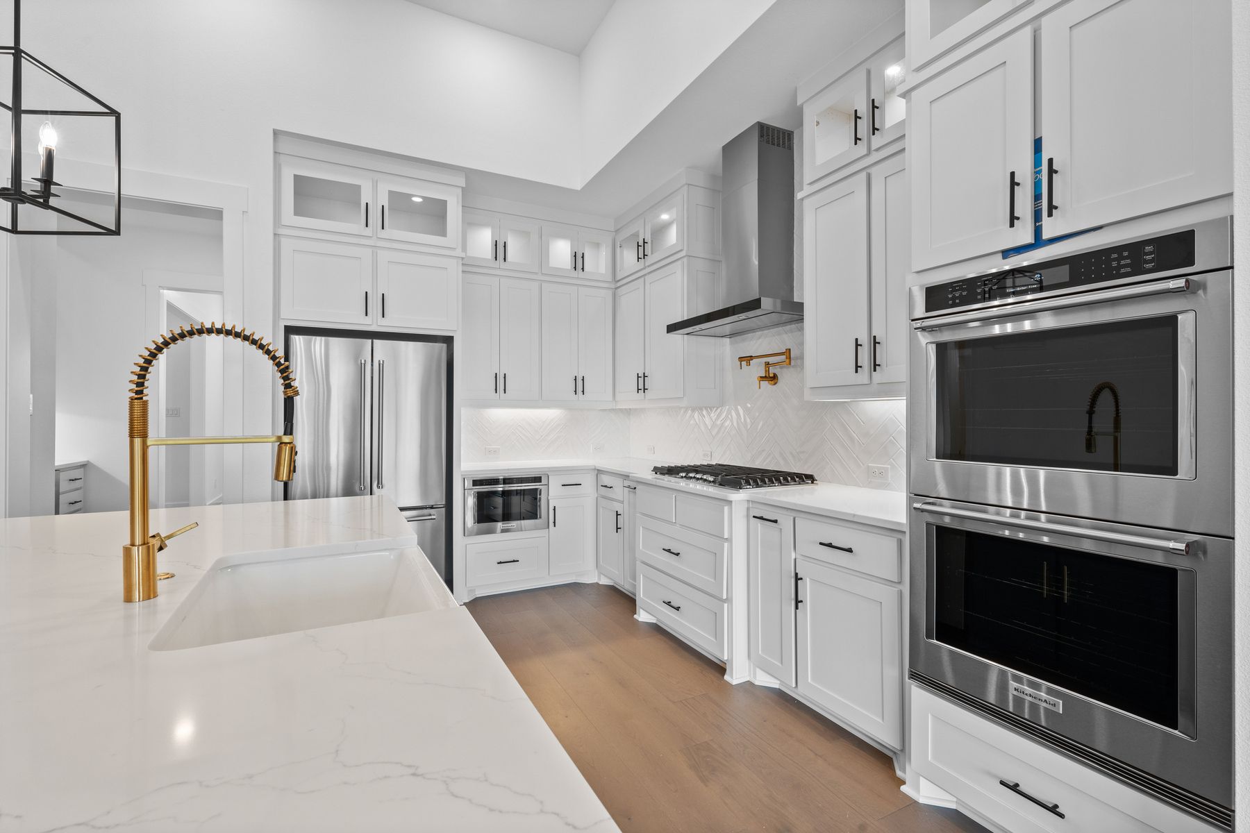 The kitchen has goregous white tile backsplash.