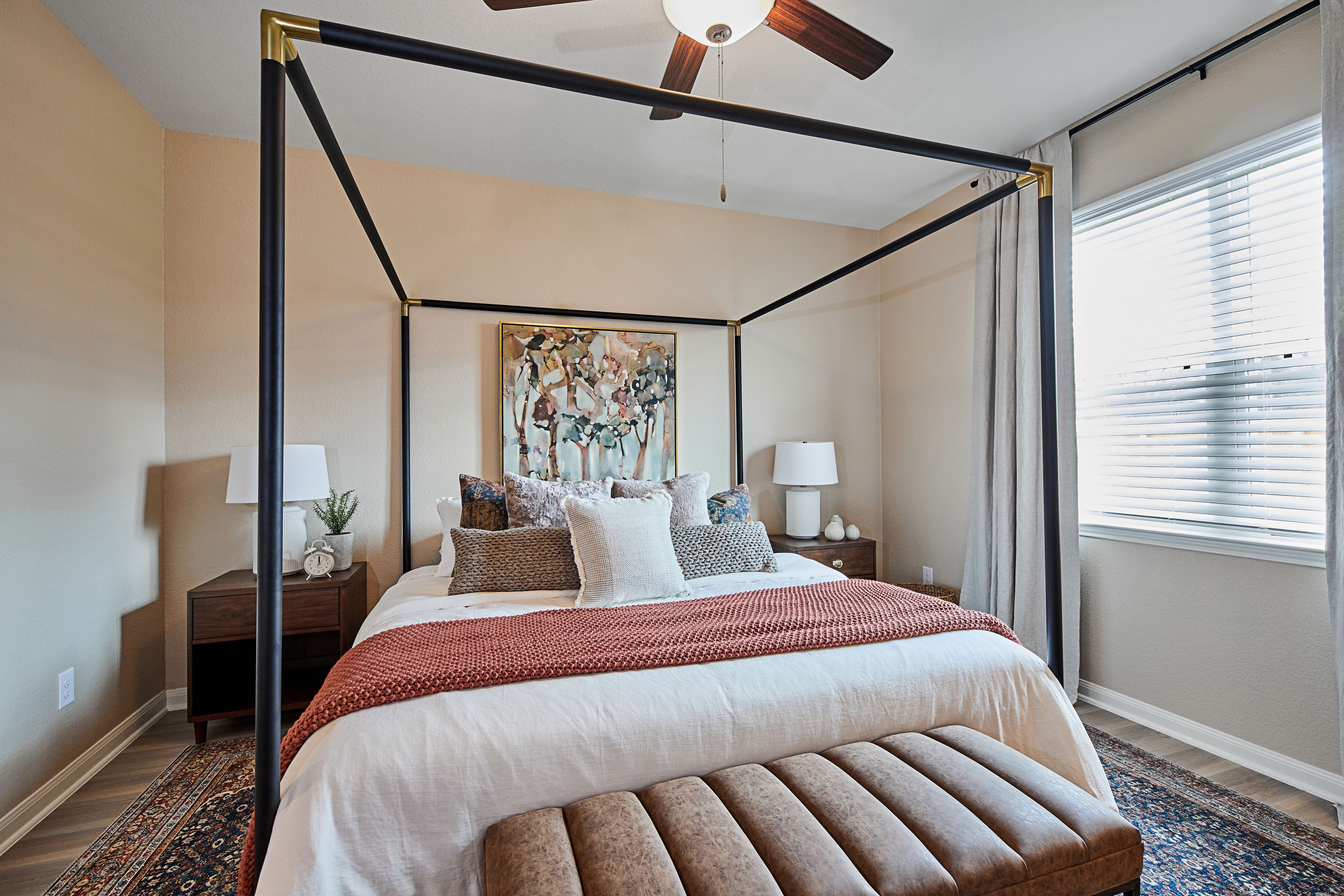 Windows let in lots of light to the master bedroom