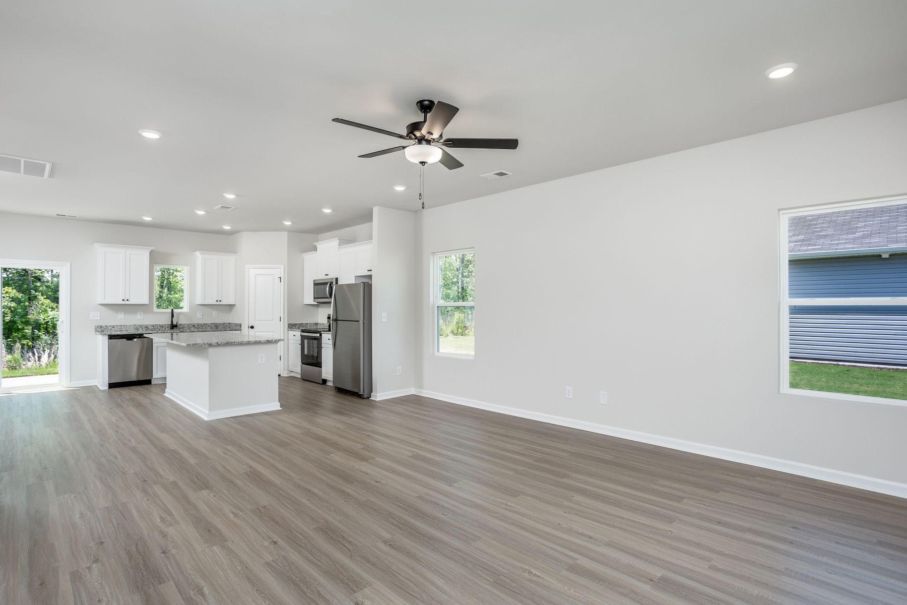 The kitchen opens to the family room and dining room.