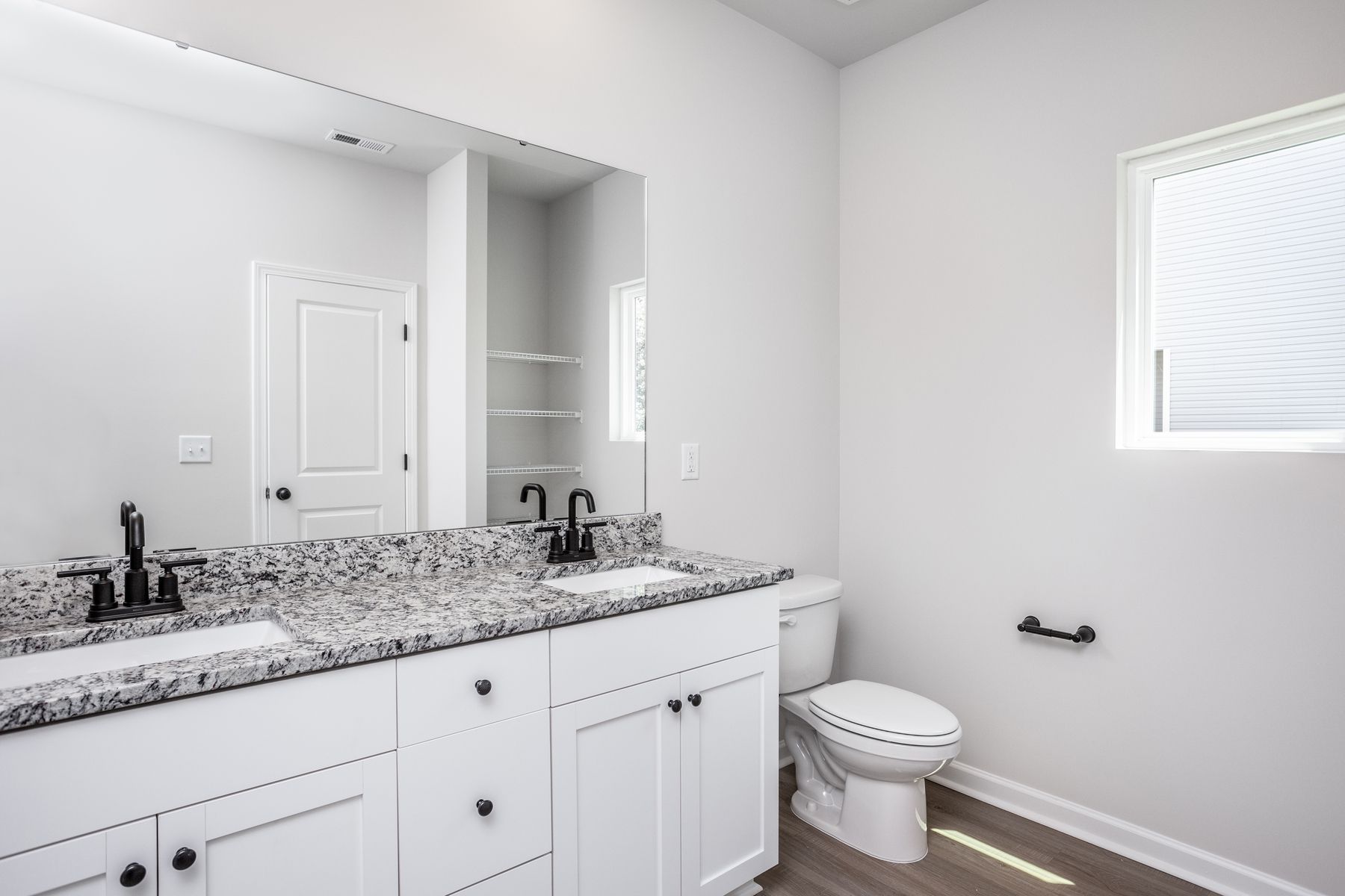 The master bathroom has dual sinks