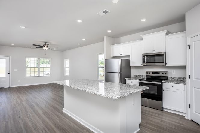 The kitchen overlooks the dining area