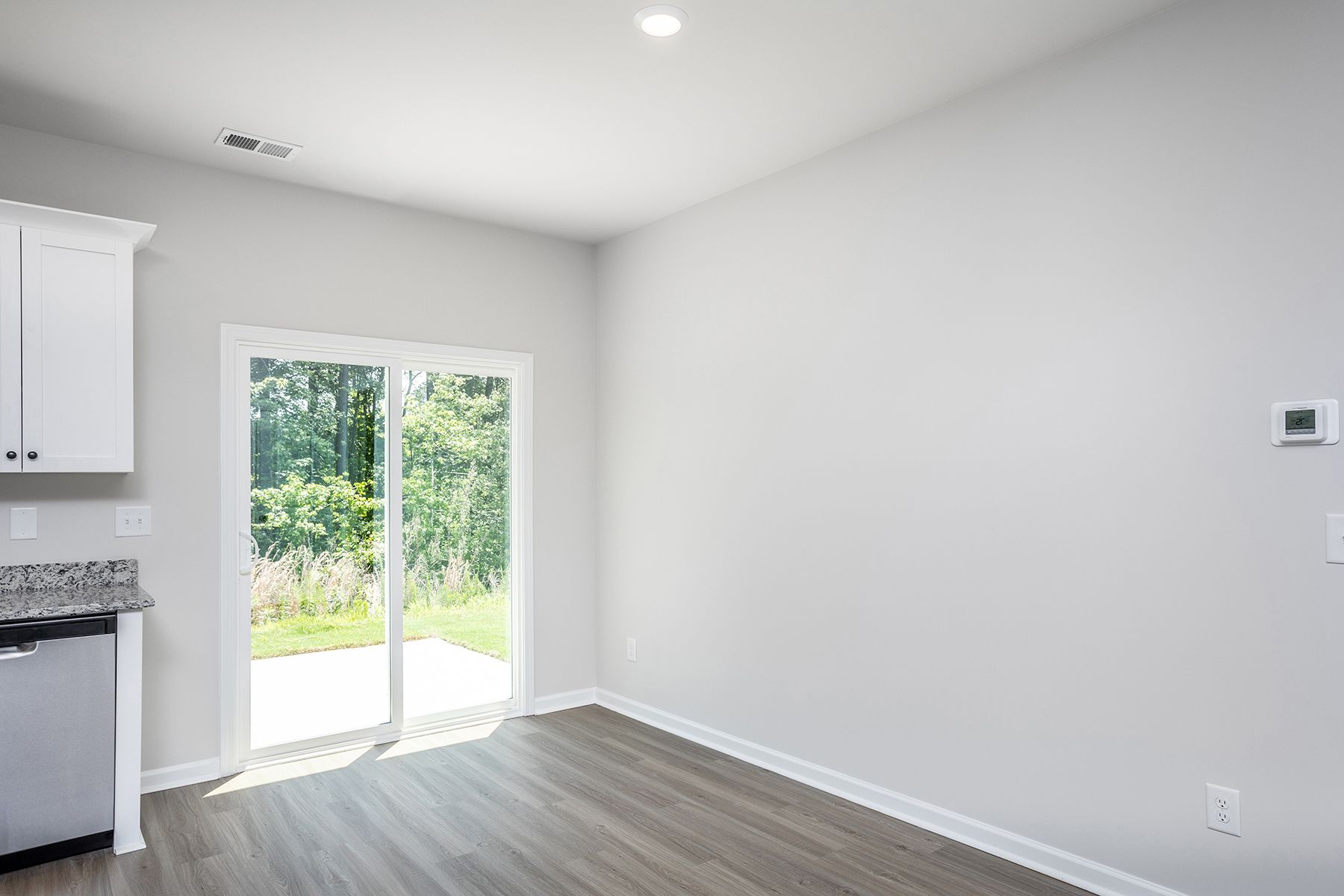 The dining room opens to the backyard