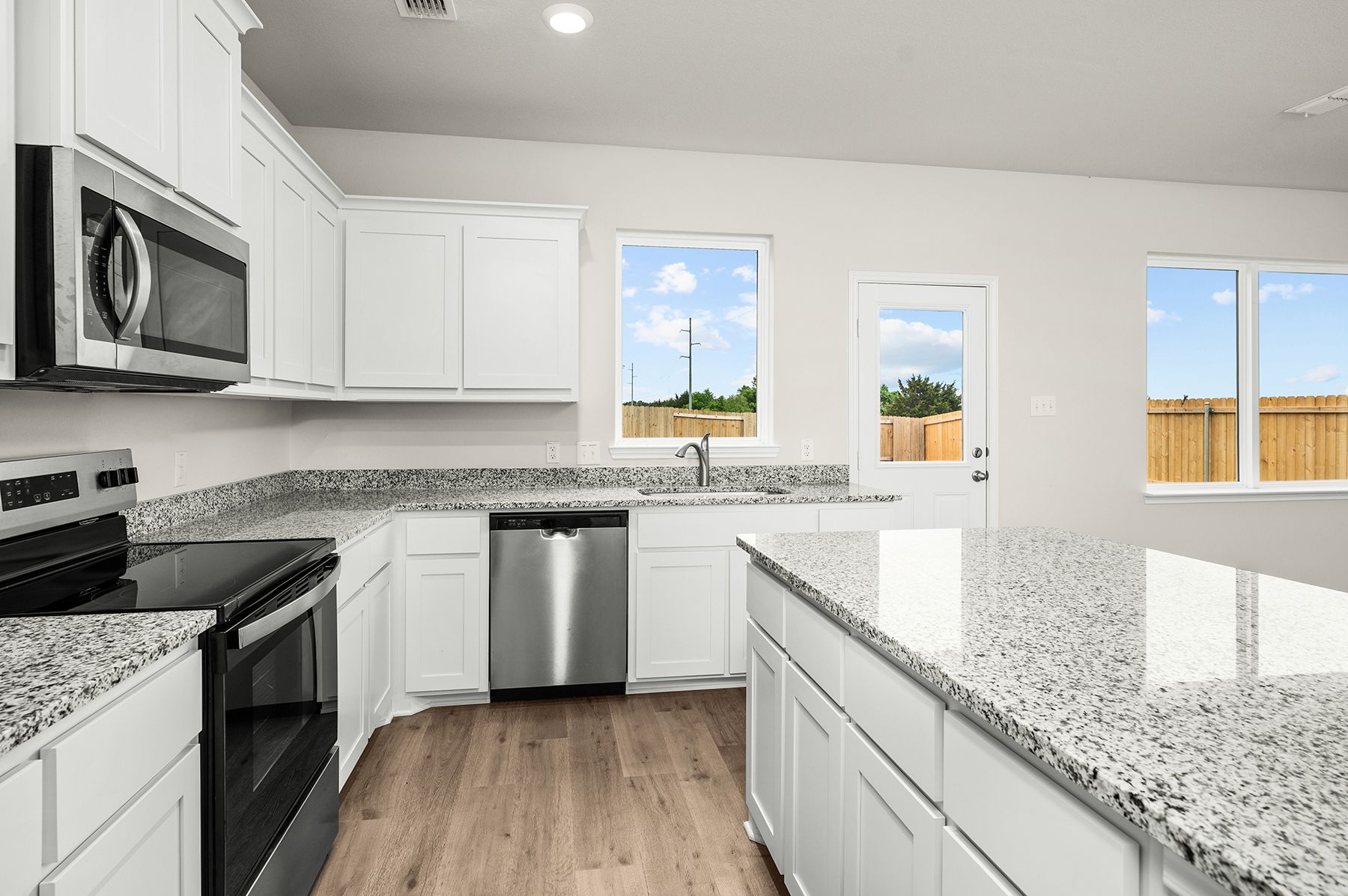 The kitchen has stainless-steel, energy-efficient appliances.