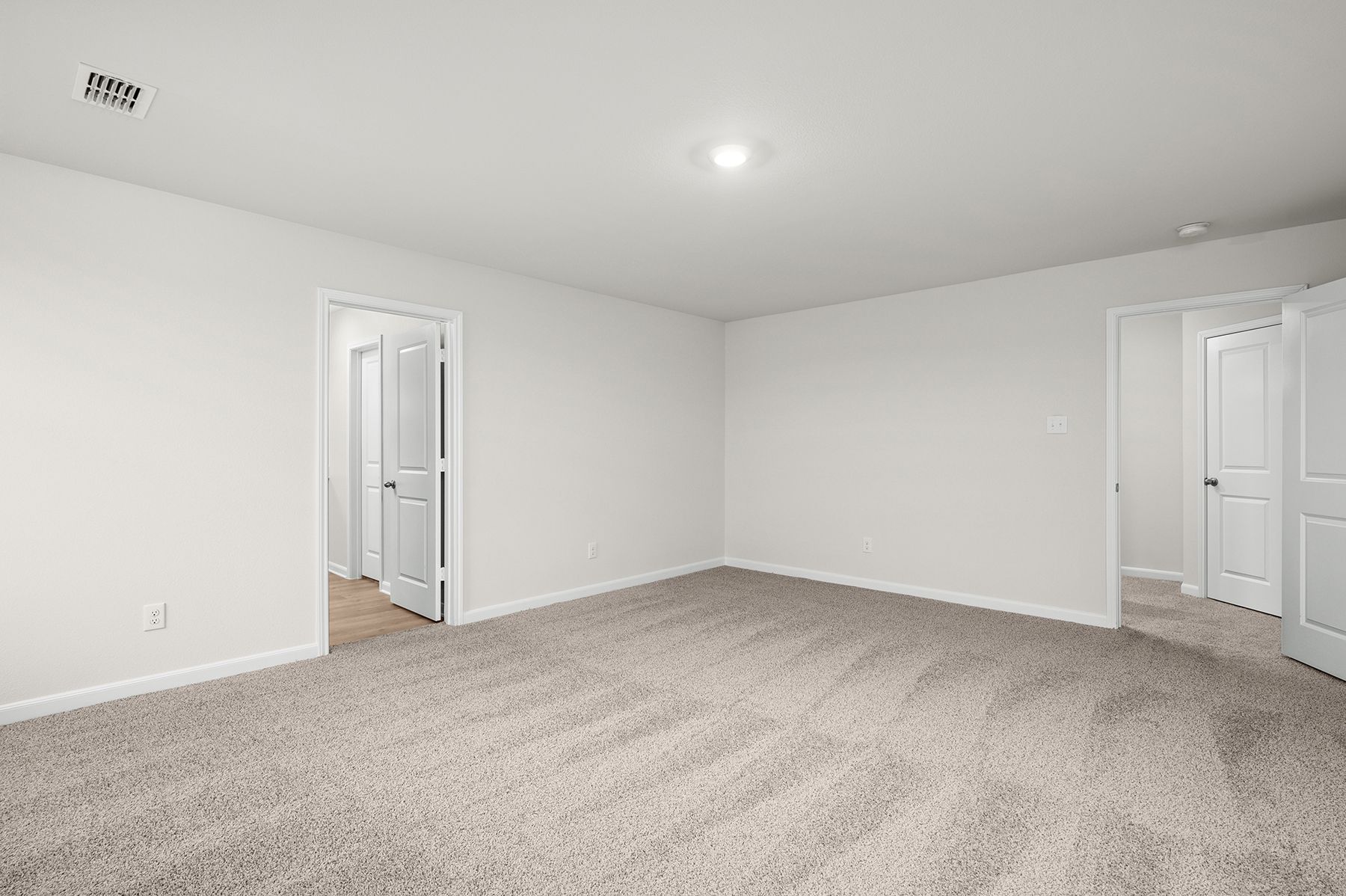 The master suite has a large bedroom, ensuite bathroom and walk-in closet. 