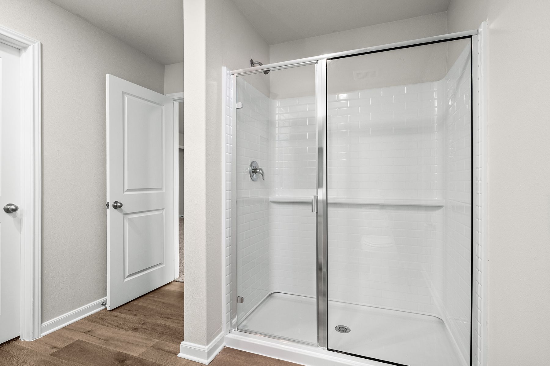 The master bathroom has a glass, walk-in shower.