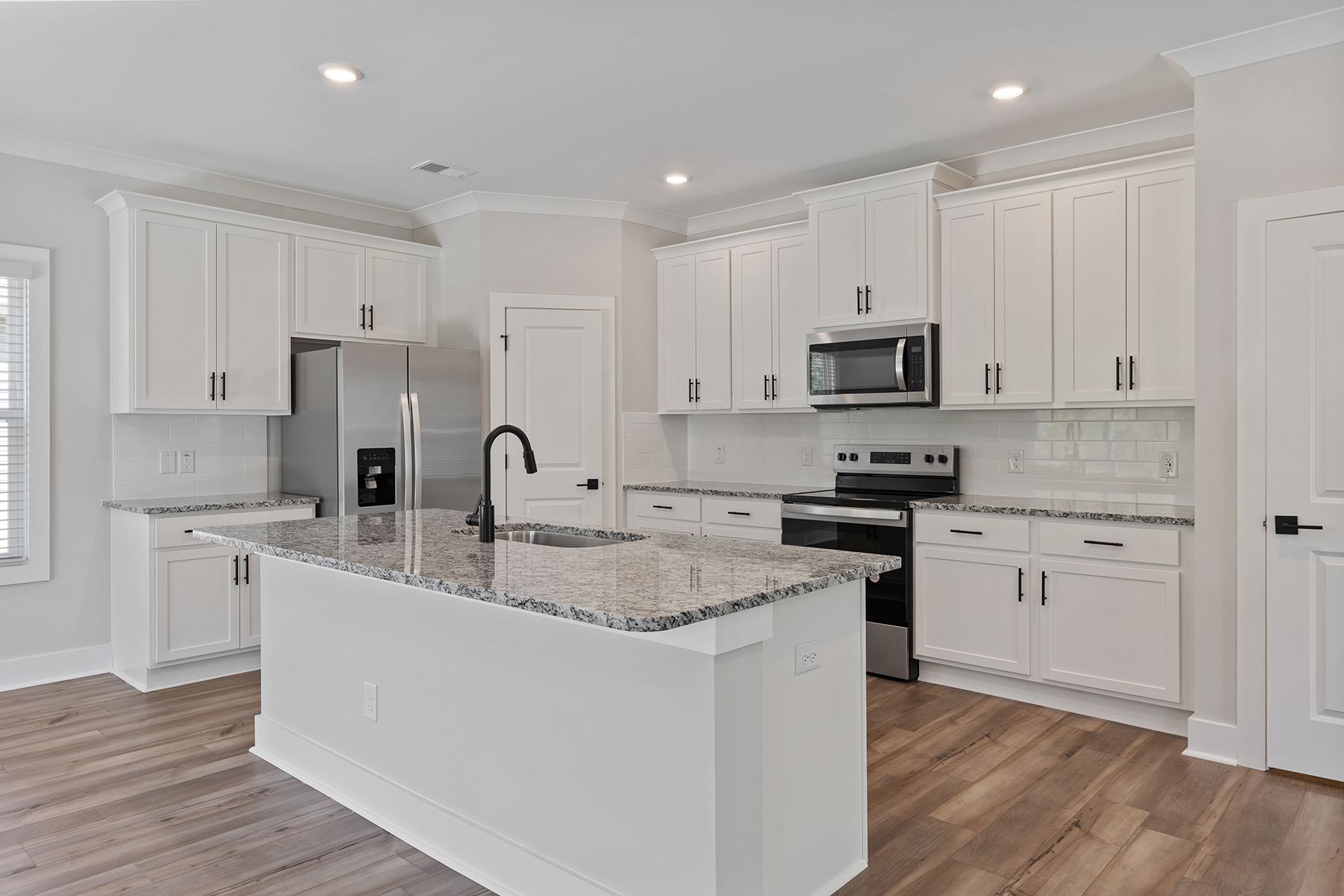 The kitchen island has lots of space for meal prep