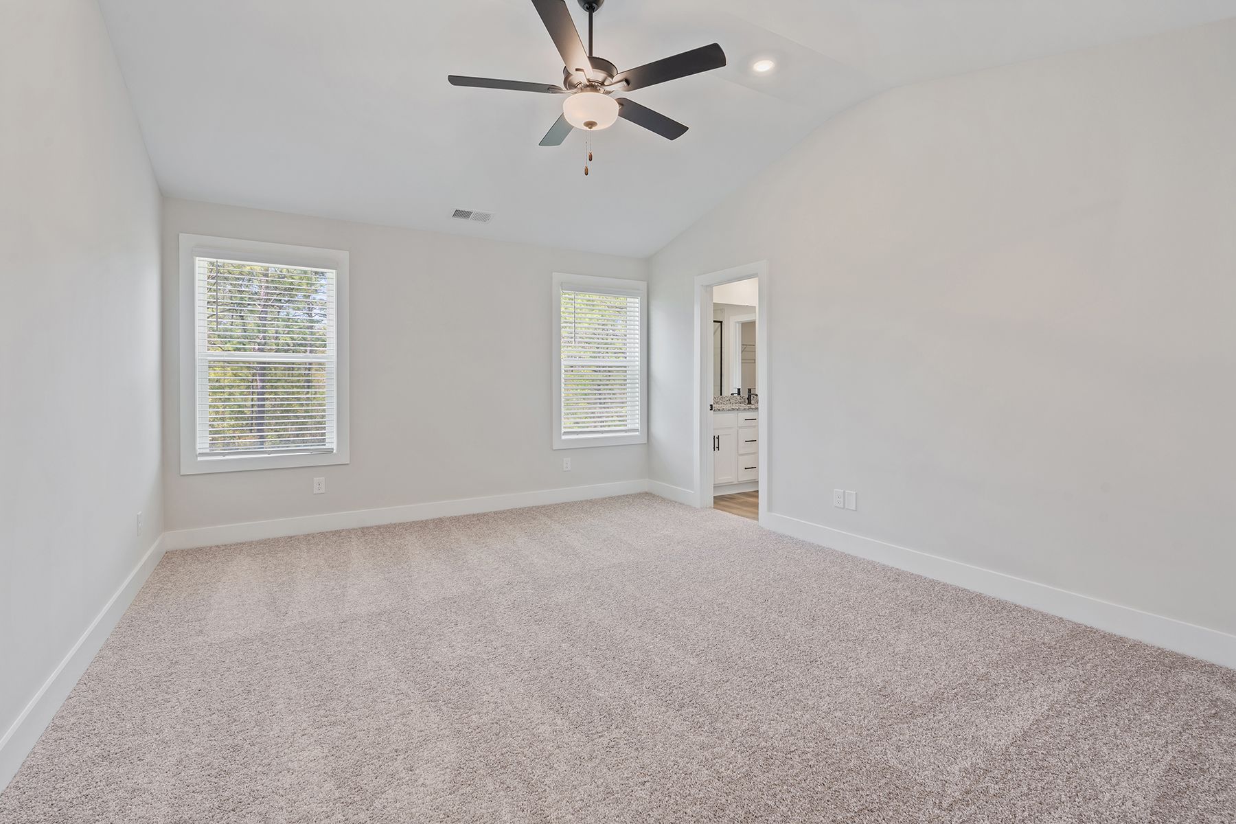 The master bedroom has cathedral ceilings
