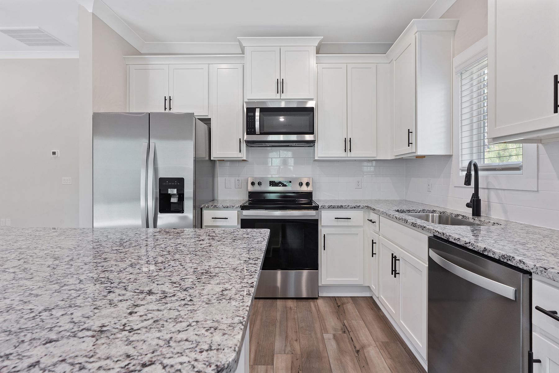 The kitchen has granite countertops