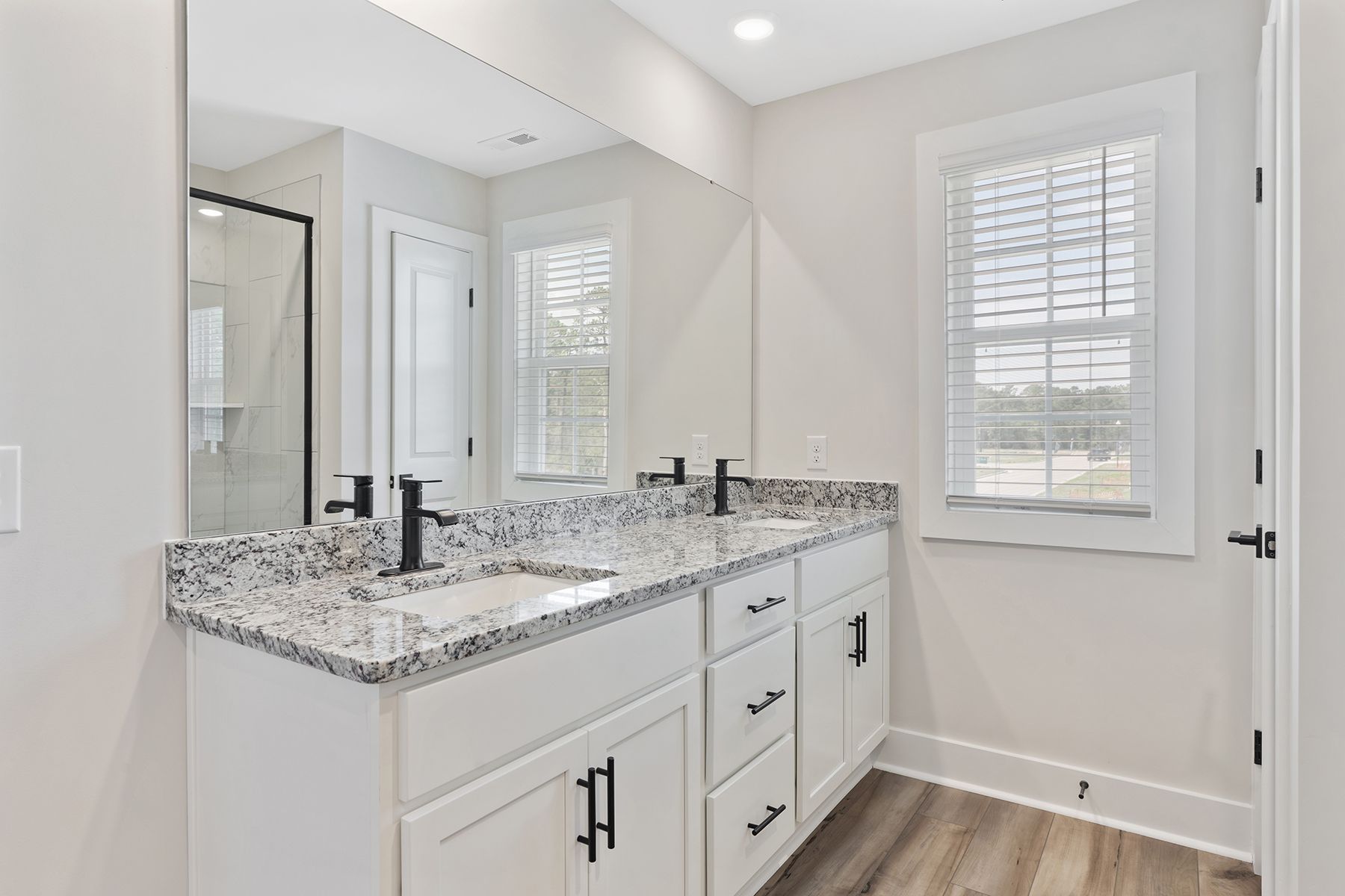 The master bathroom has double vanities