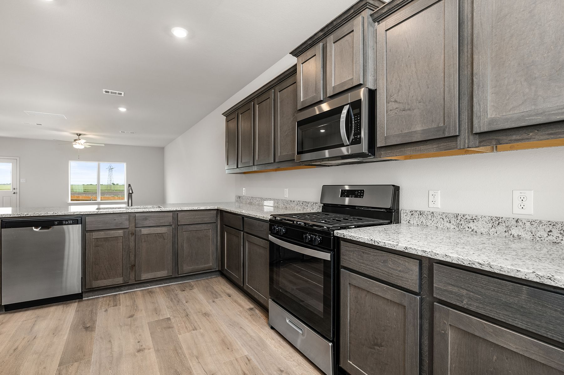 The kitchen has sprawling granite countertops.