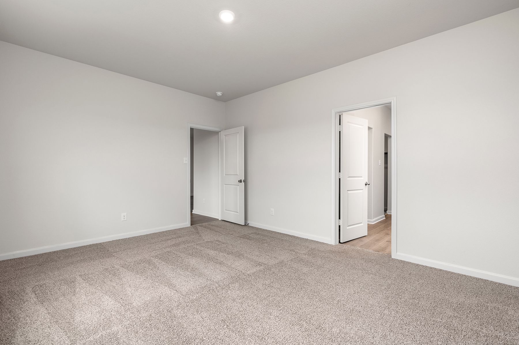 The master suite has a large bedroom, ensuite bathroom and a walk-in closet.