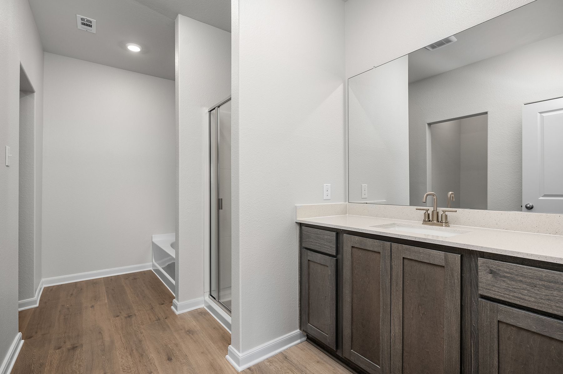 The master bathroom has a large vanity space.