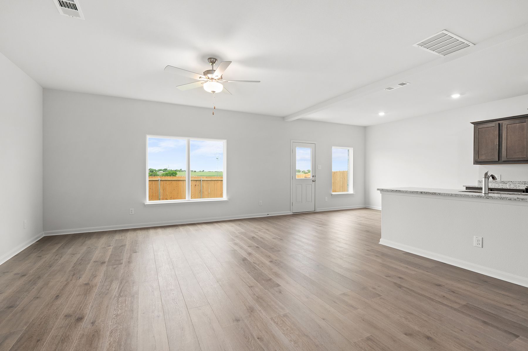 The family room has a large window that lets in great, natural light.