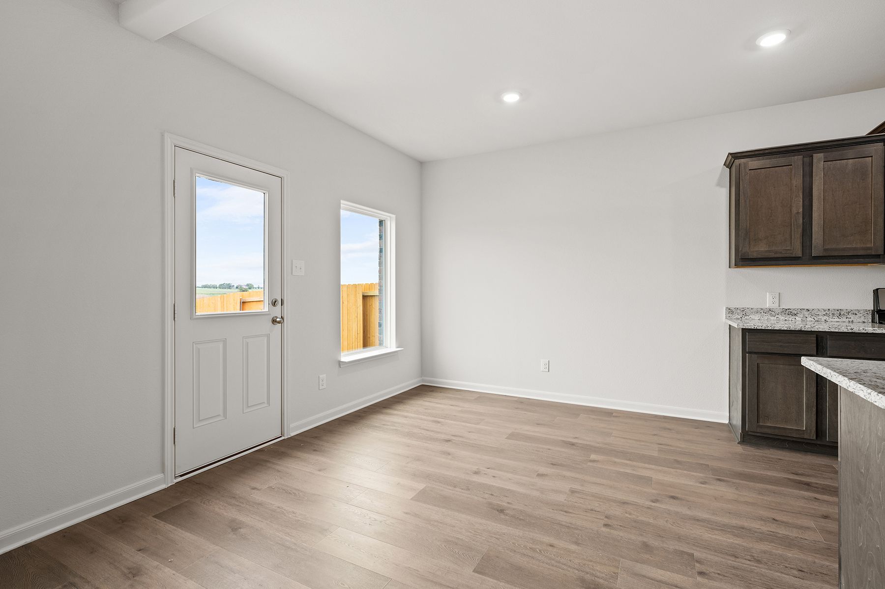 The dining room has a large window that lets in great, natural light.