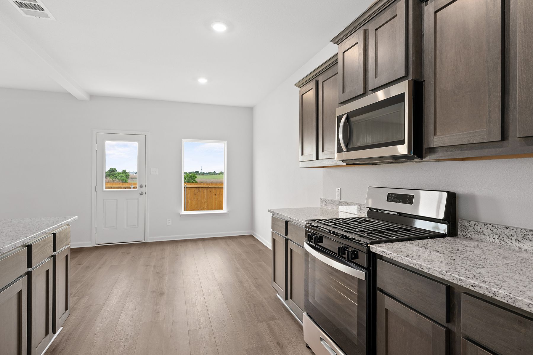 The kitchen has sprawling granite countertops.