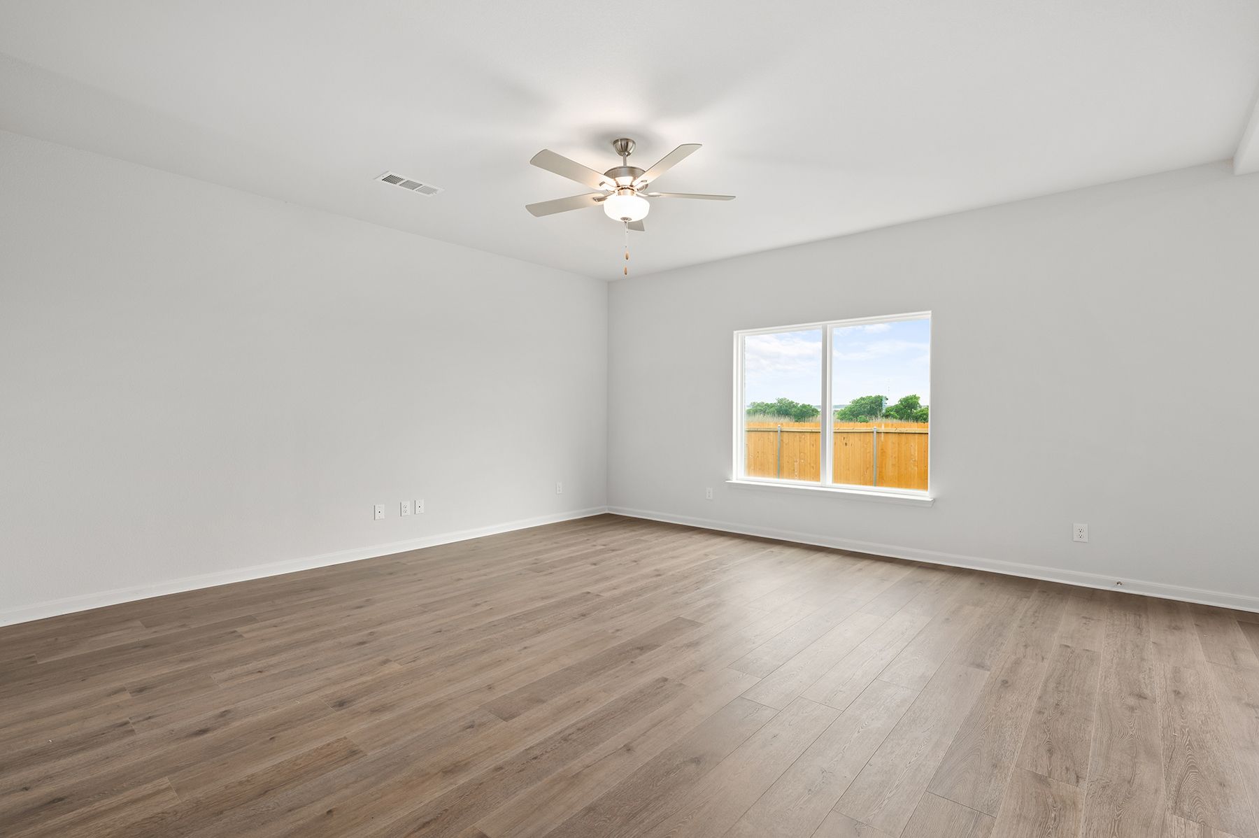 The family room is spacious and built to fit lots of furniture.