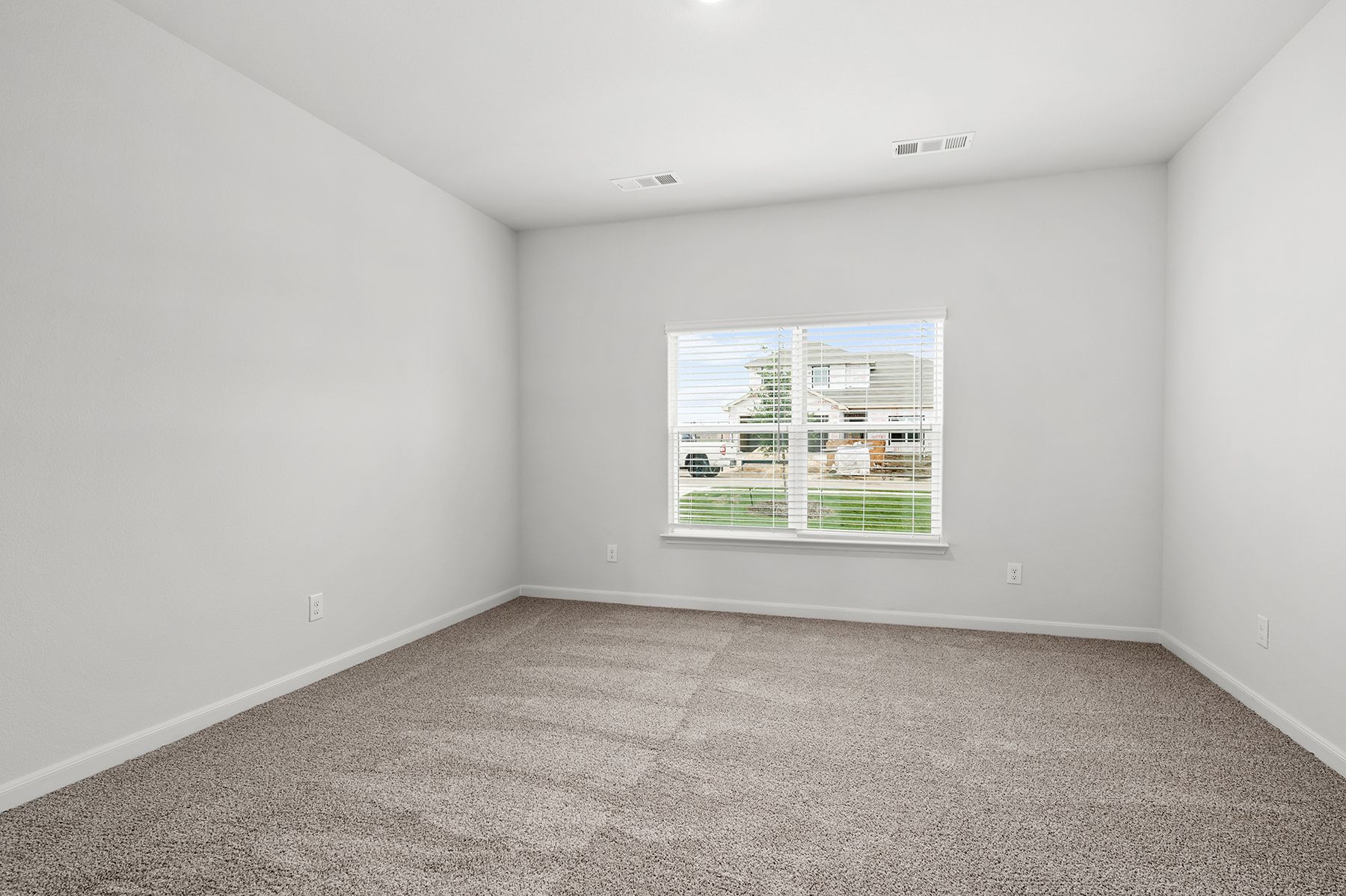 The master bedroom has a large window that lets in great, natural light and back yard views.