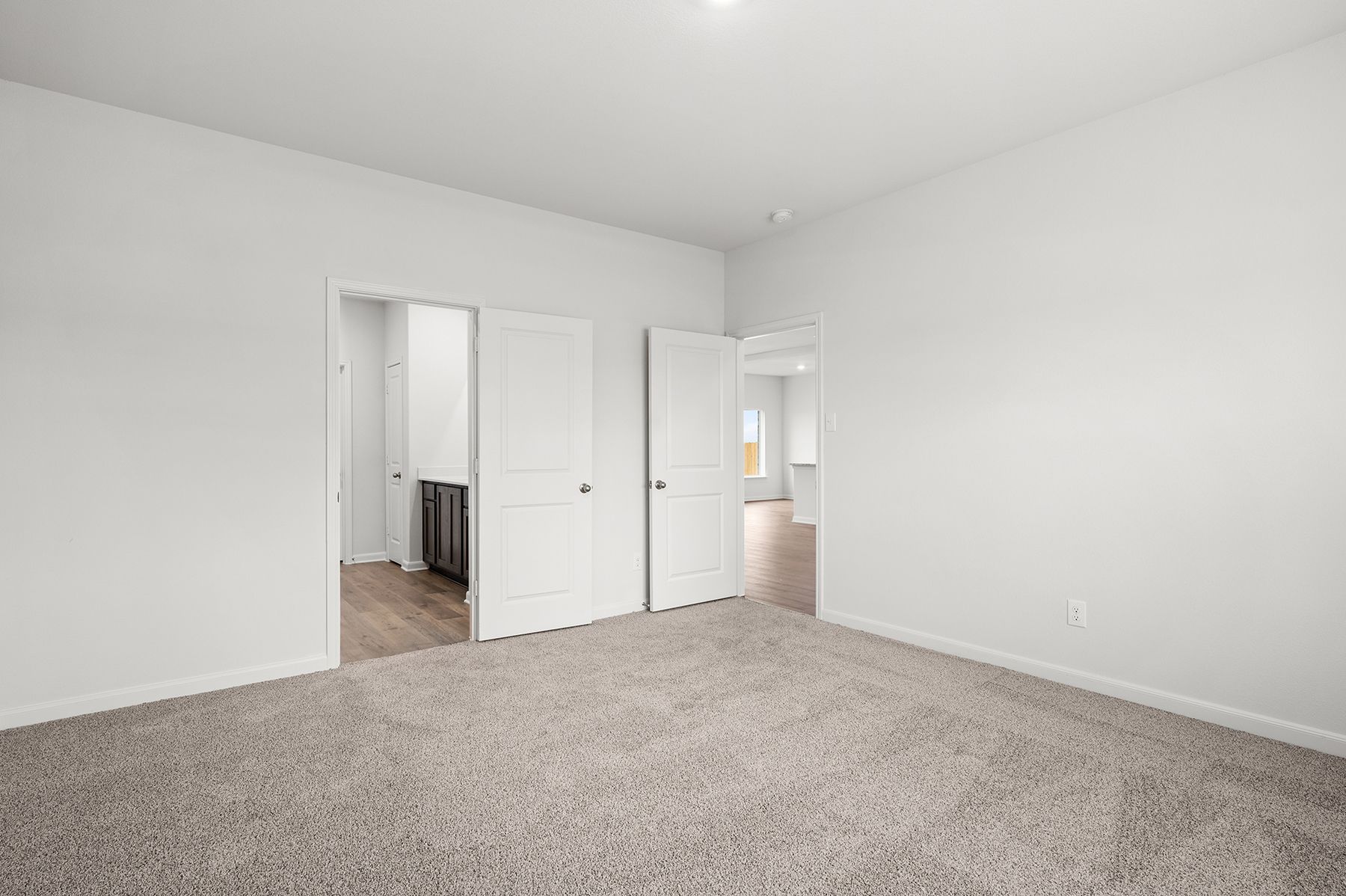 The master suite has a large bedroom, ensuite bathroom and walk-in closet.
