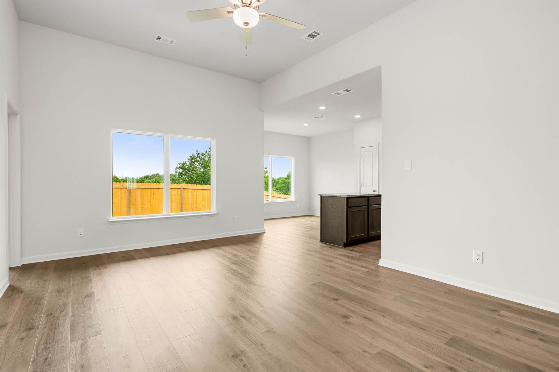 The family room has a large window that lets in great, natural light.