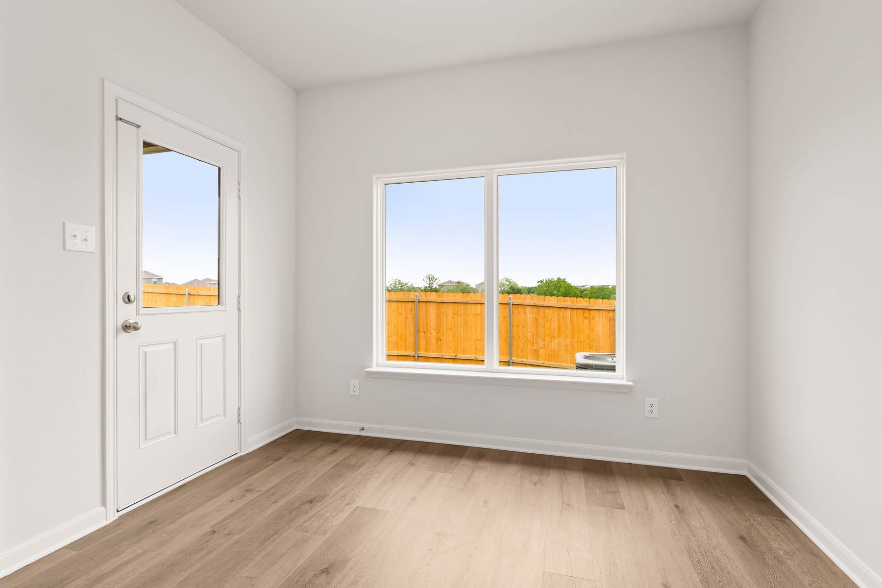 The dining room has a large window that lets in great, natural light.