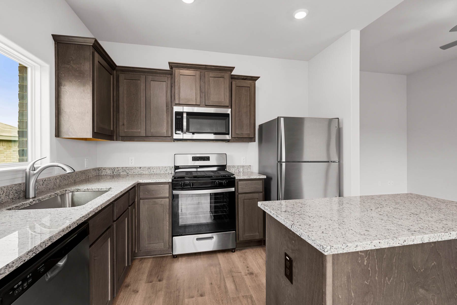 The kitchen has beautiful wood cabinetry.