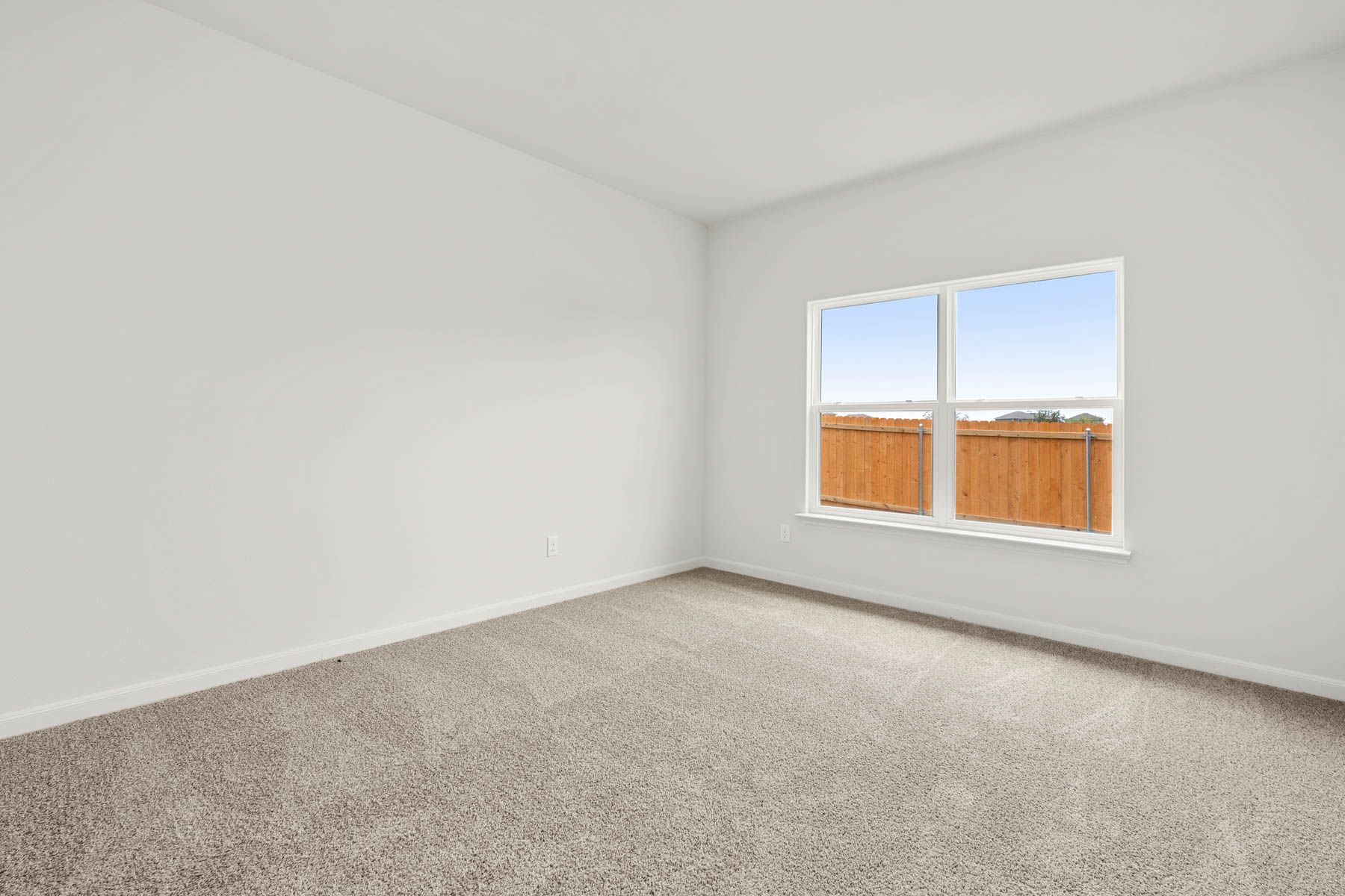 The master bedroom has a large window that lets in great, natural light.
