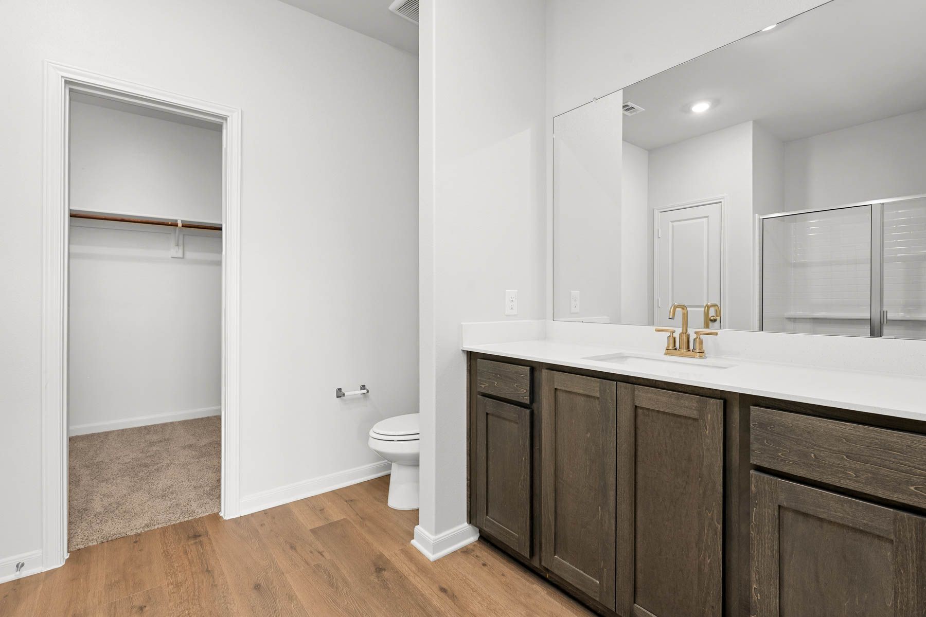 The master bathroom has a sprawling vanity space.