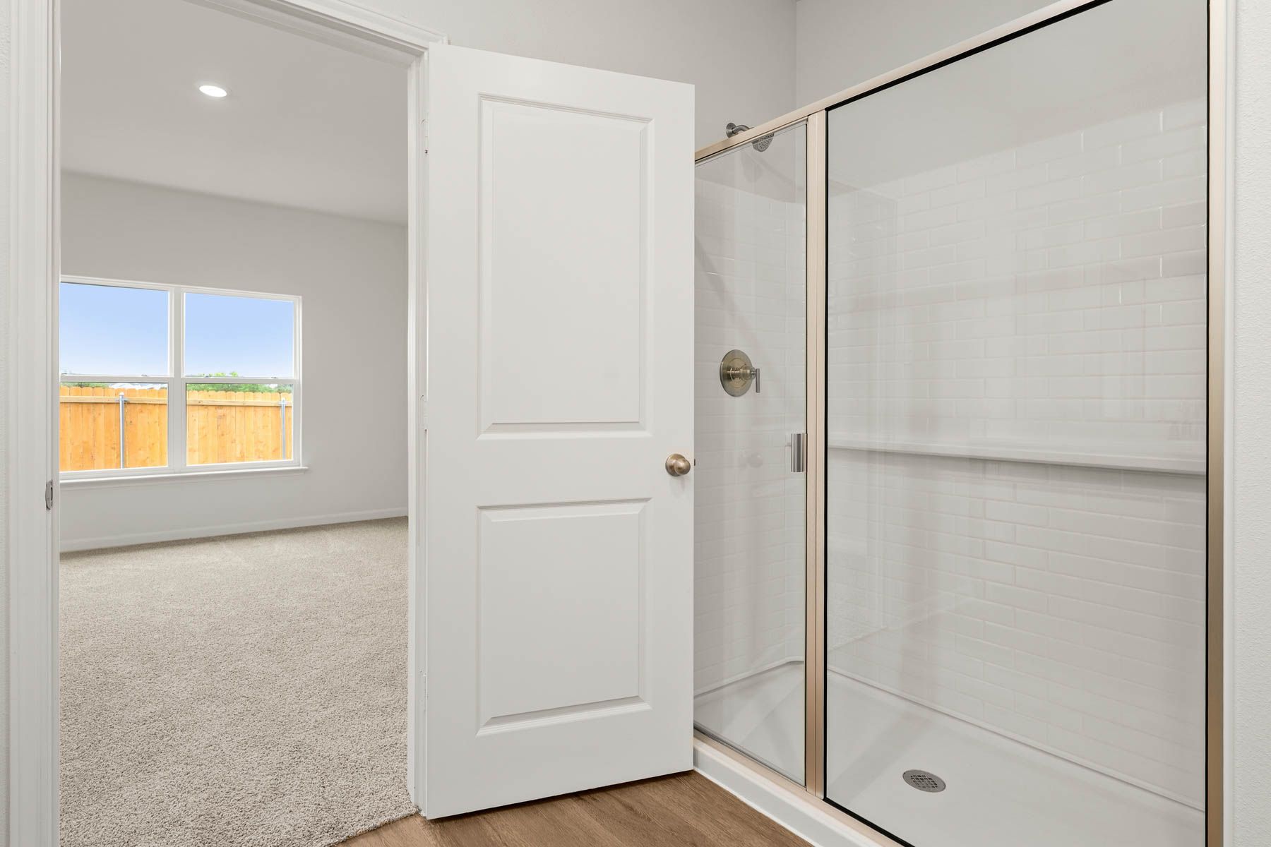The master bathroom has a glass, walk-in shower.
