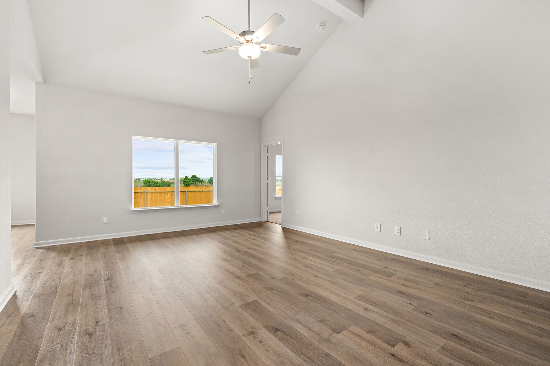 The family room of the Sabine has a large window that lets in great, natural light.