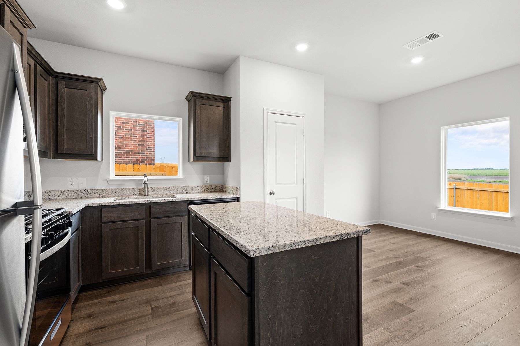 The kitchen has sprawling granite countertops.