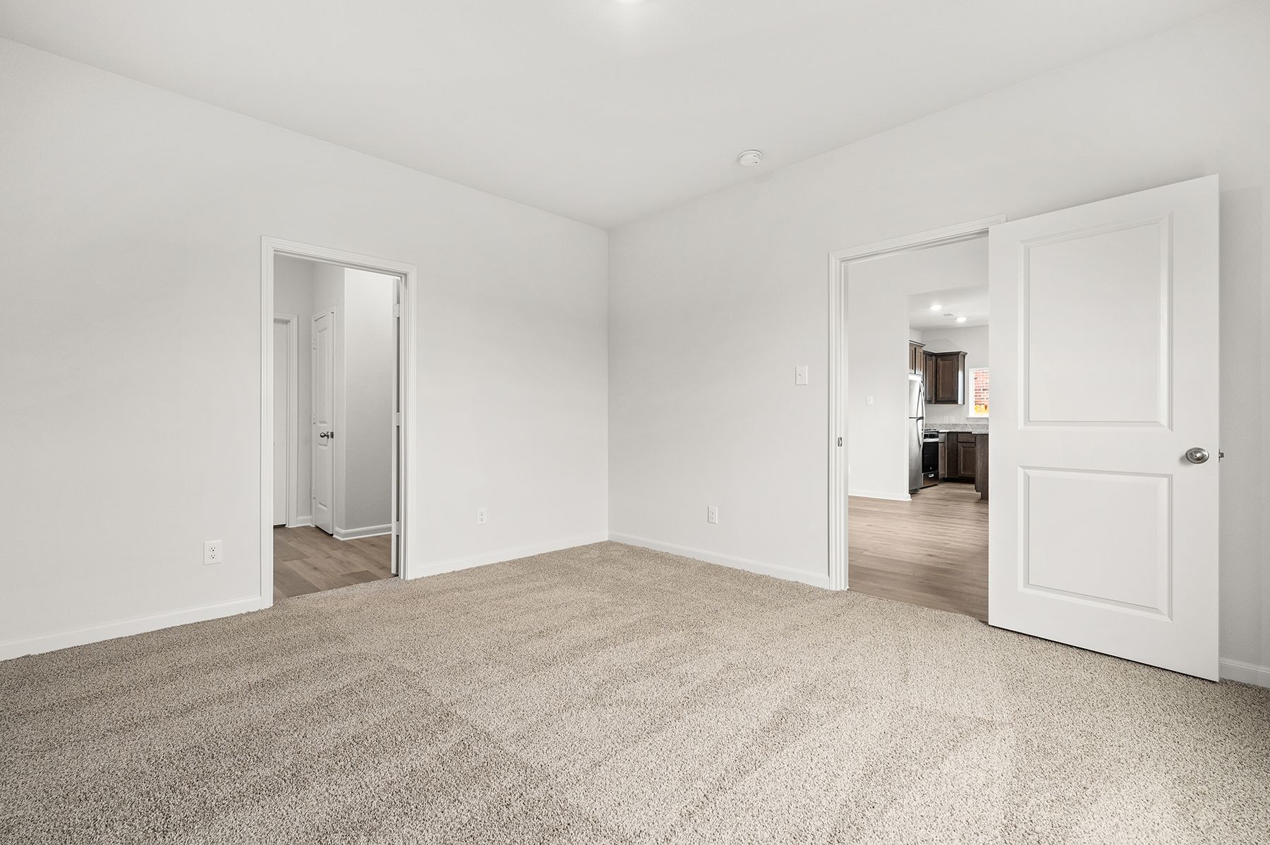 The master suite has a large bedroom, ensuite bathroom and walk-in closet.