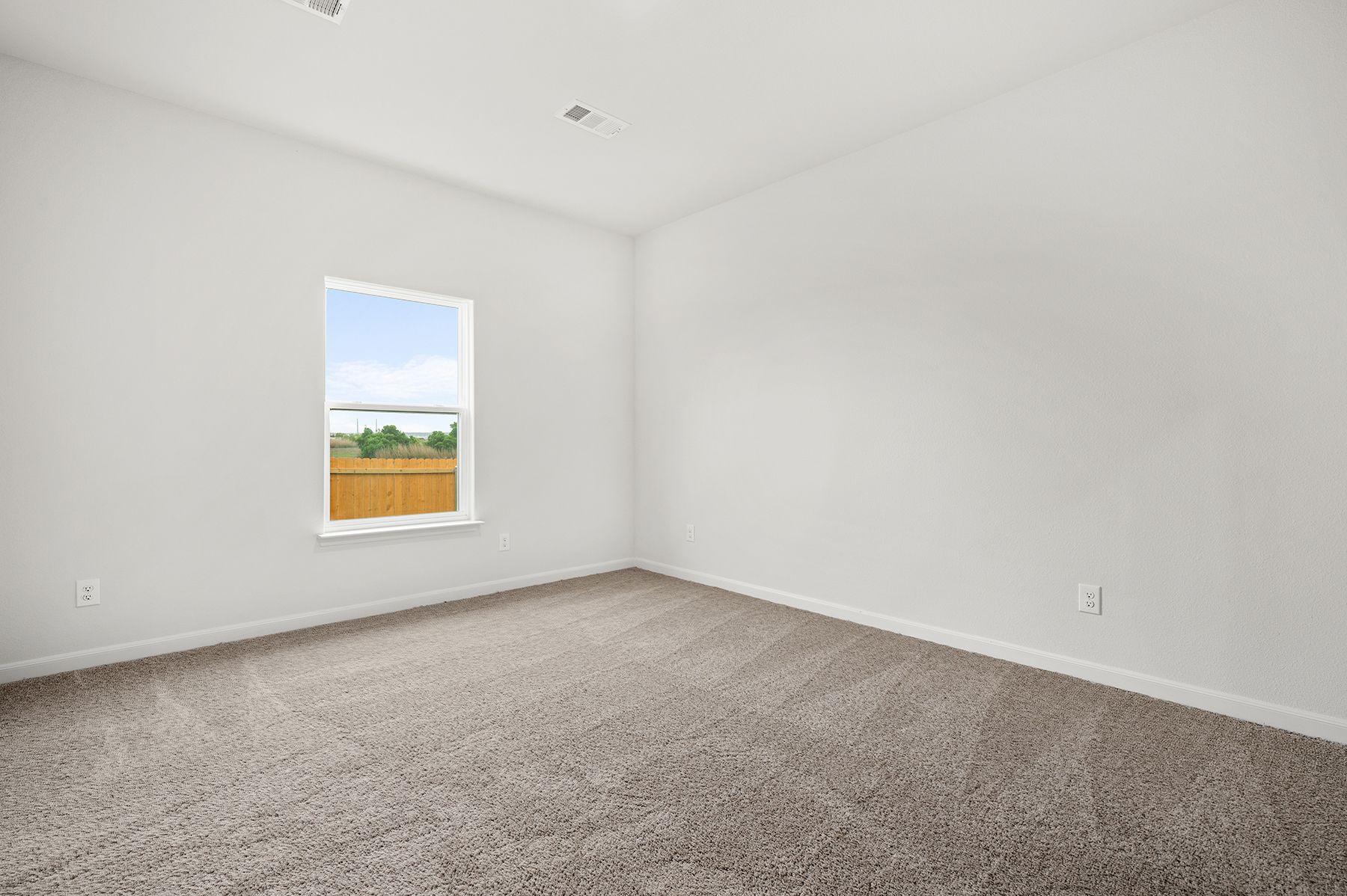 The master bedroom has a large window that lets in great, natural light.