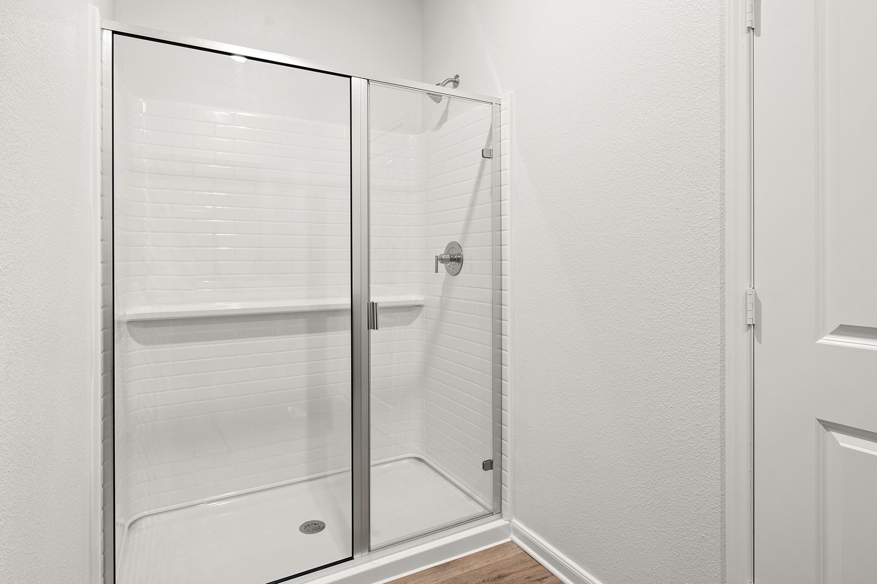 The master bathroom has a glass, walk-in shower.