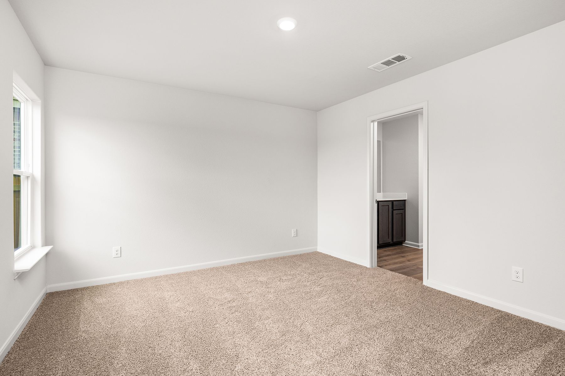 The master suite has a large bedroom, ensuite bathroom and walk-in closet.