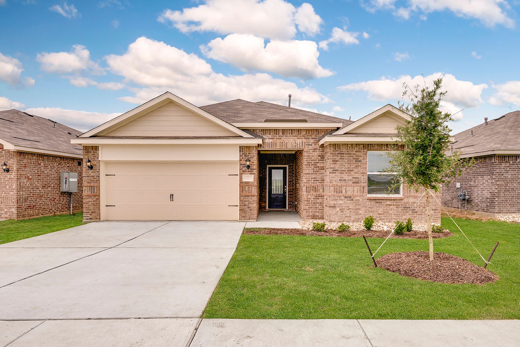 The Reed is a beautiful, one-story brick home.