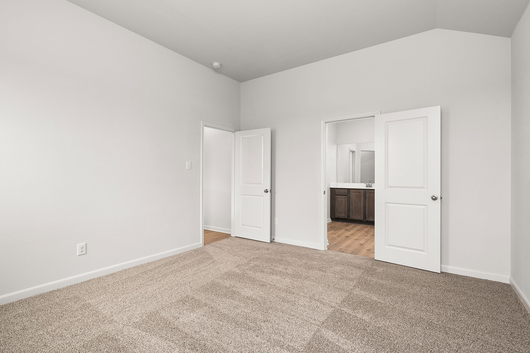 The master suite includes a large bedroom, ensuite bathroom and walk-in closet.