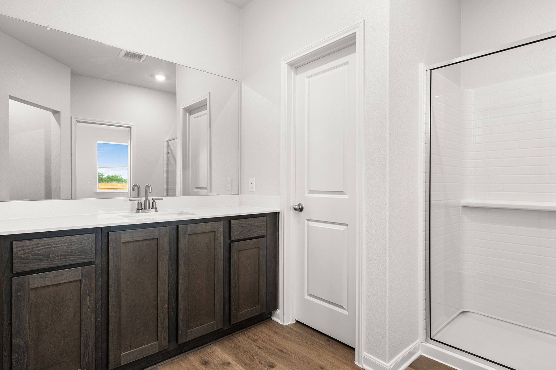 The master bathroom has a large vanity space.