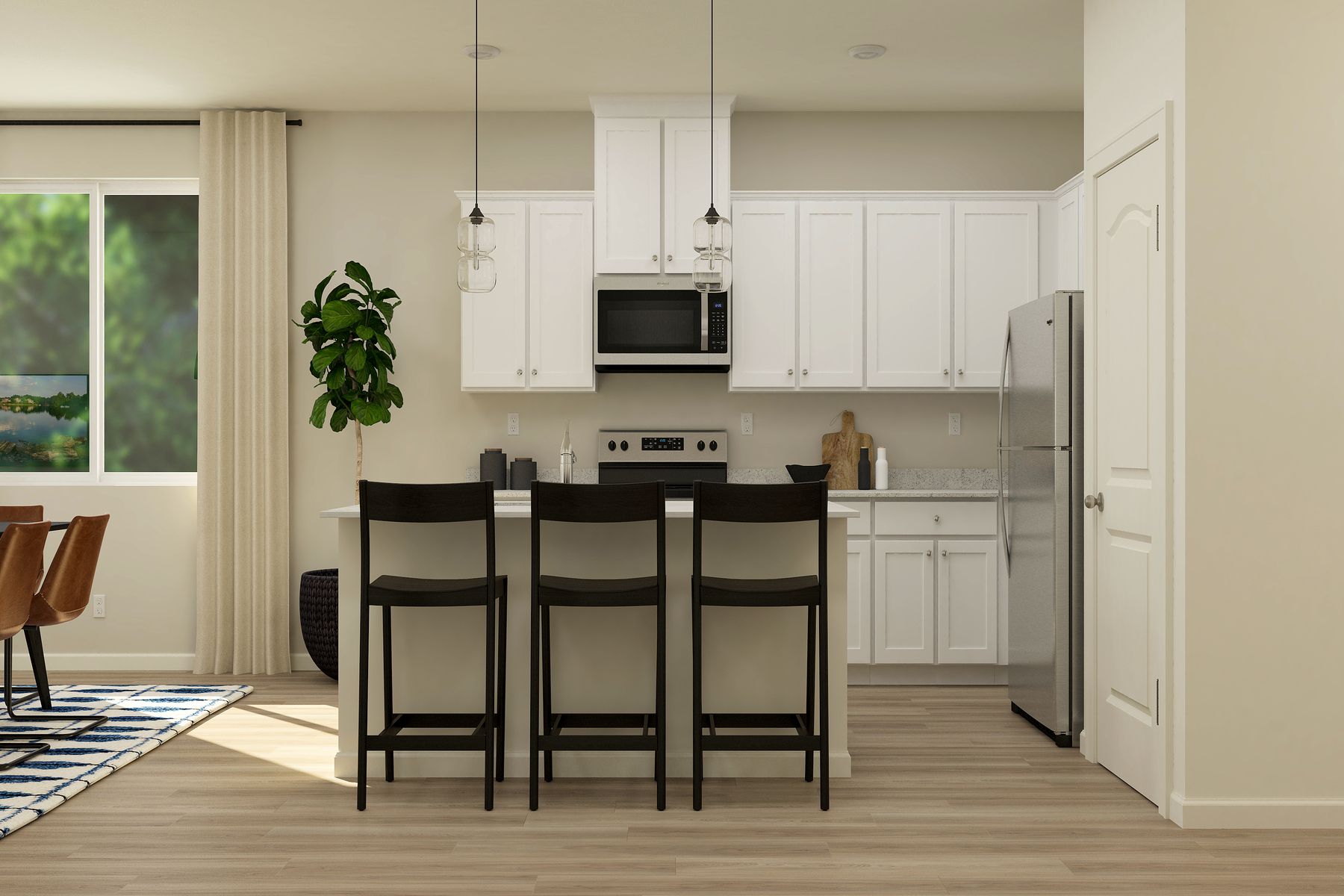 The kitchen has beautiful white wood cabinetry.