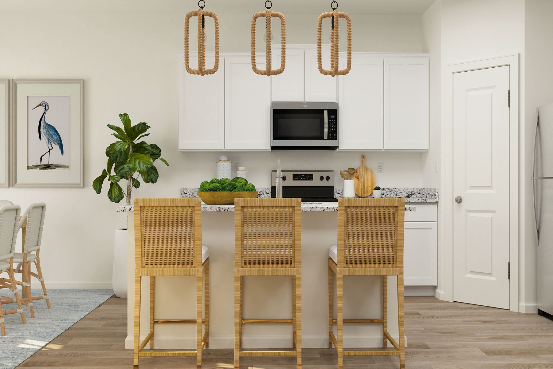 The kitchen of the Granite has white cabinetry and sprawling granite countertops.