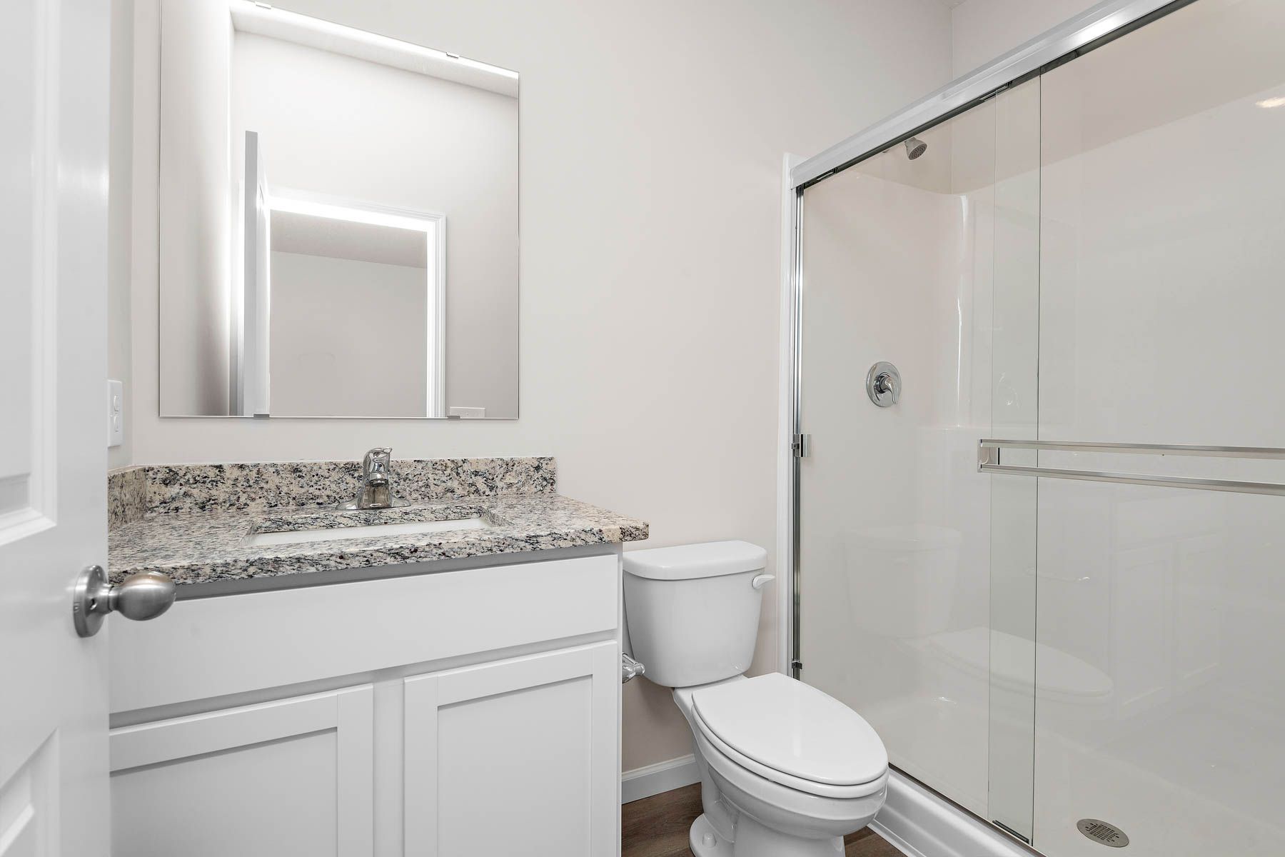The master bathroom has a large vanity.