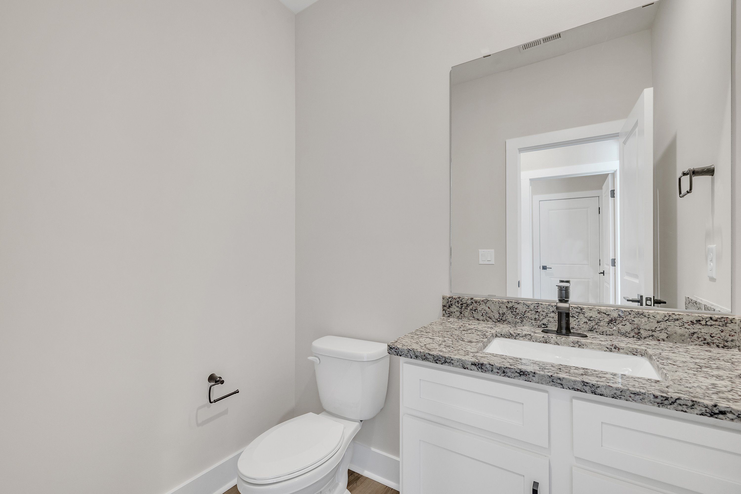 The bathrooms have granite countertops