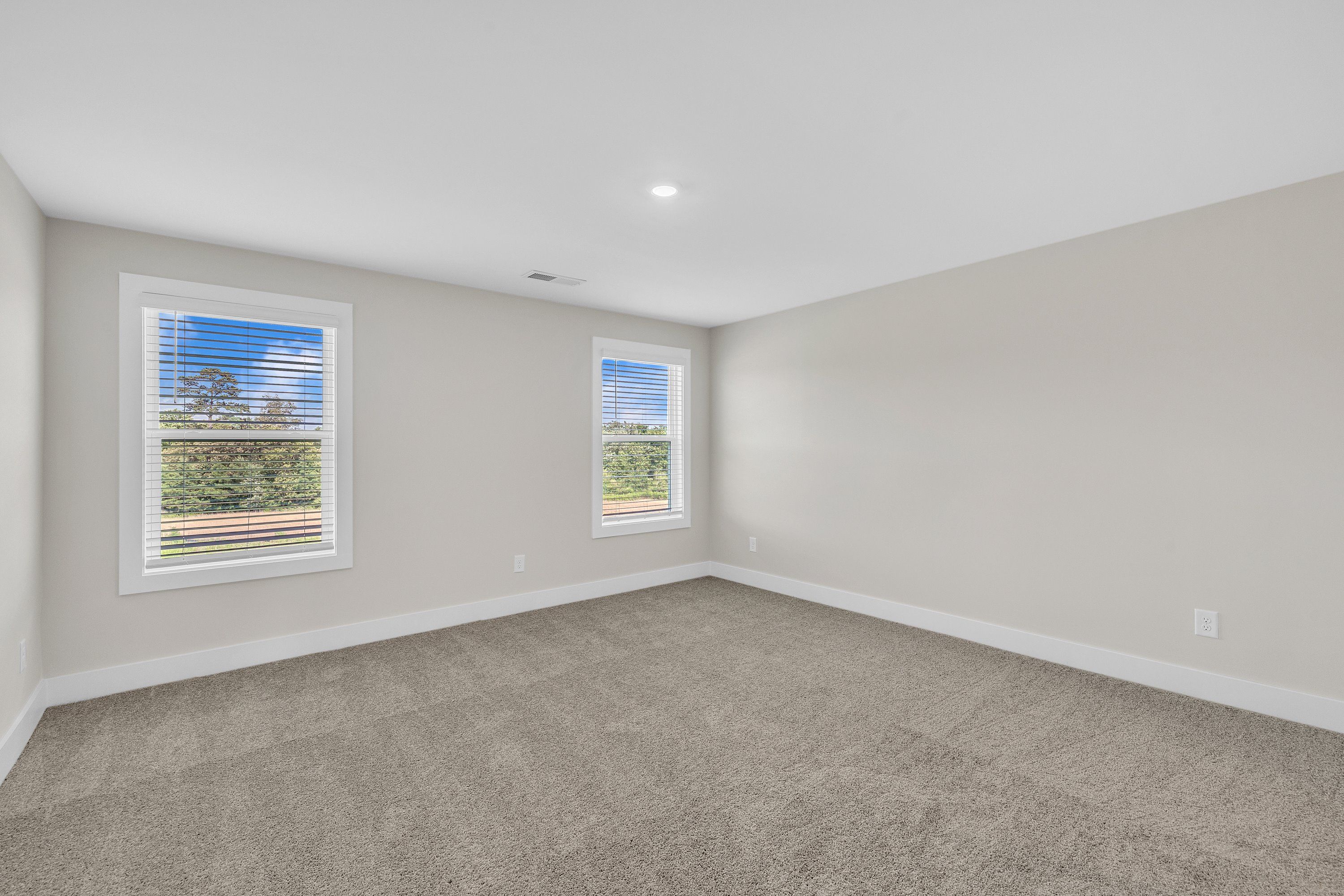Windows let in light to each bedroom.