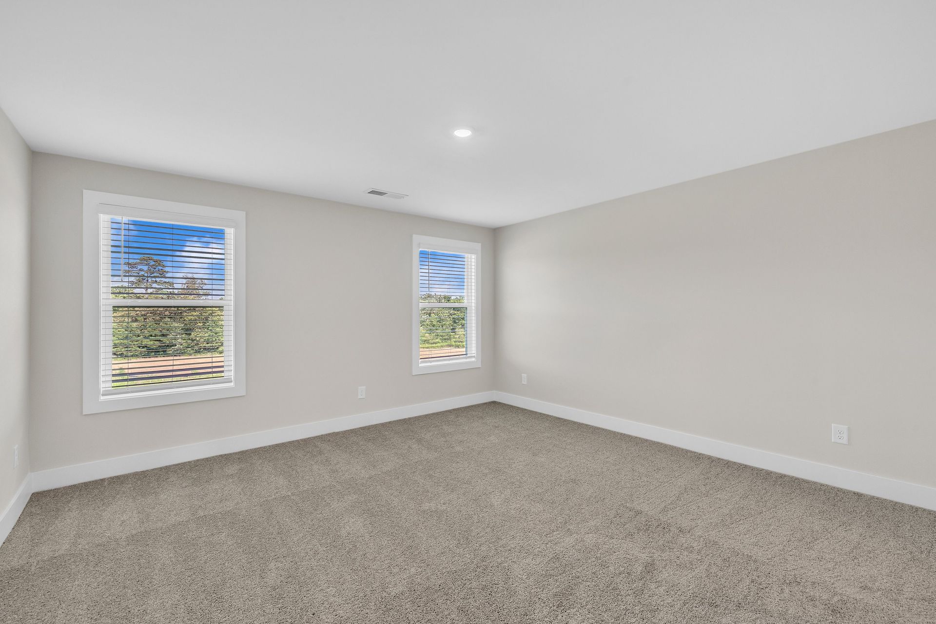 Windows let in light to each bedroom.