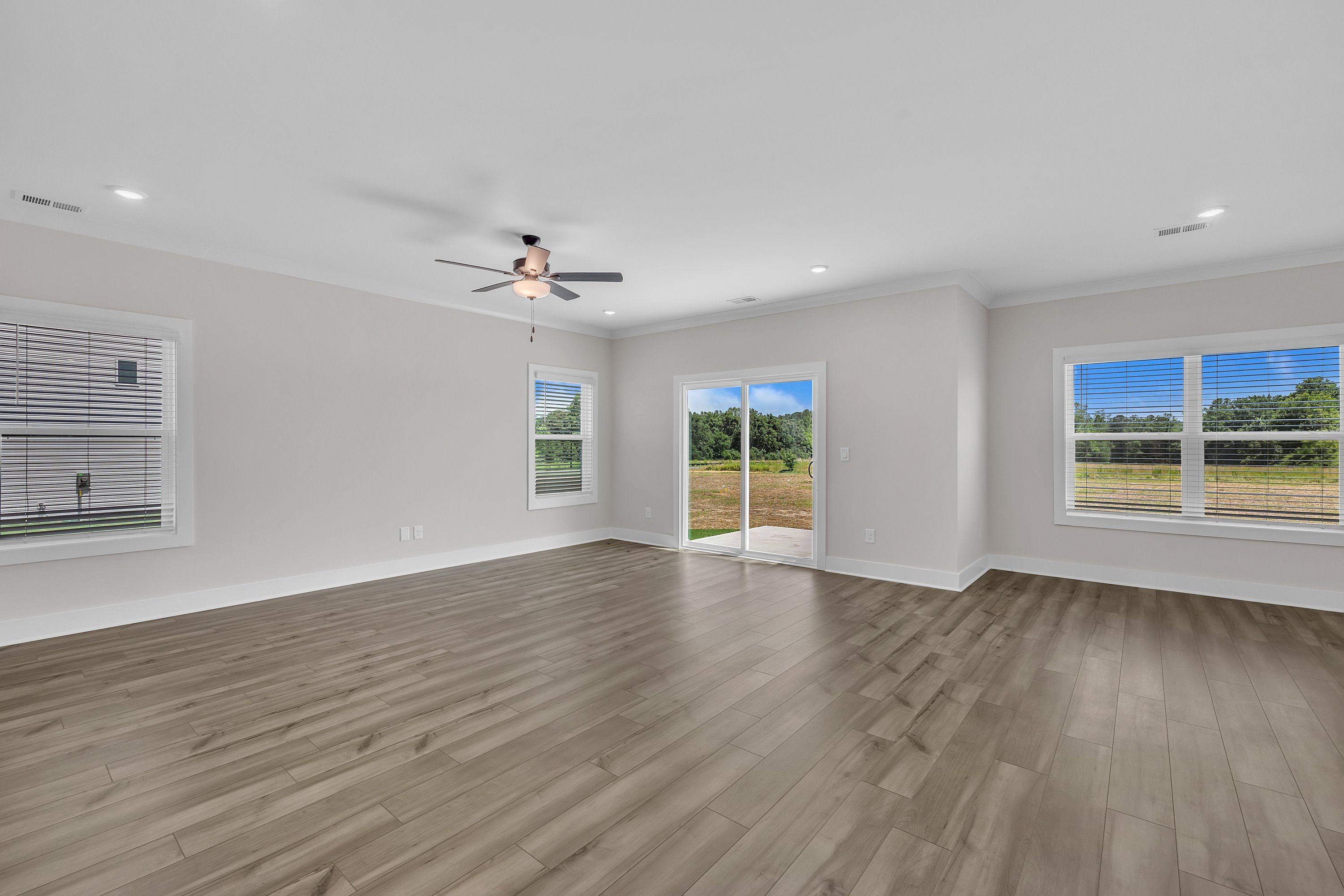 Vinyl wood flooring throughout. 