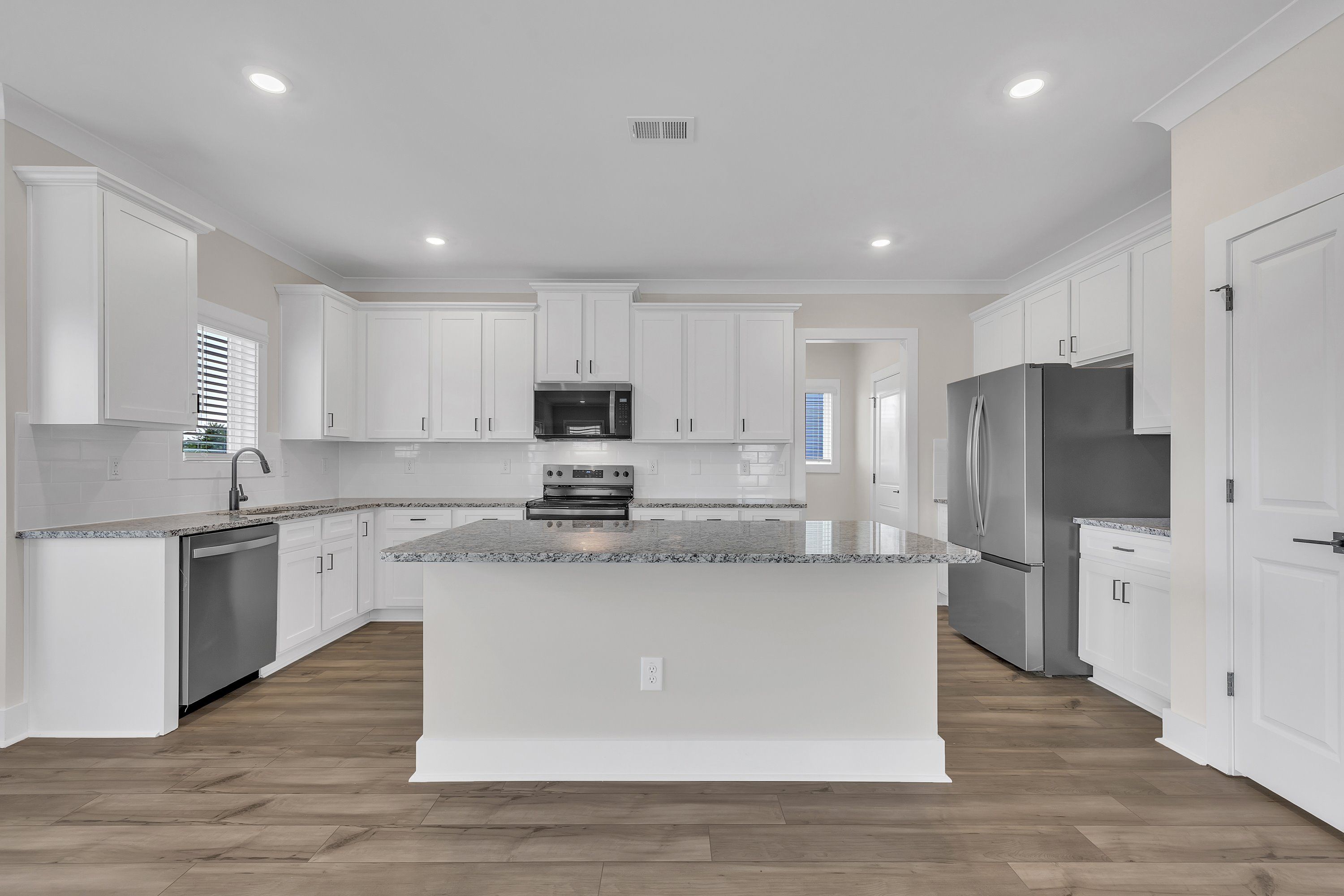 The kitchen has a spacious kitchen island. 